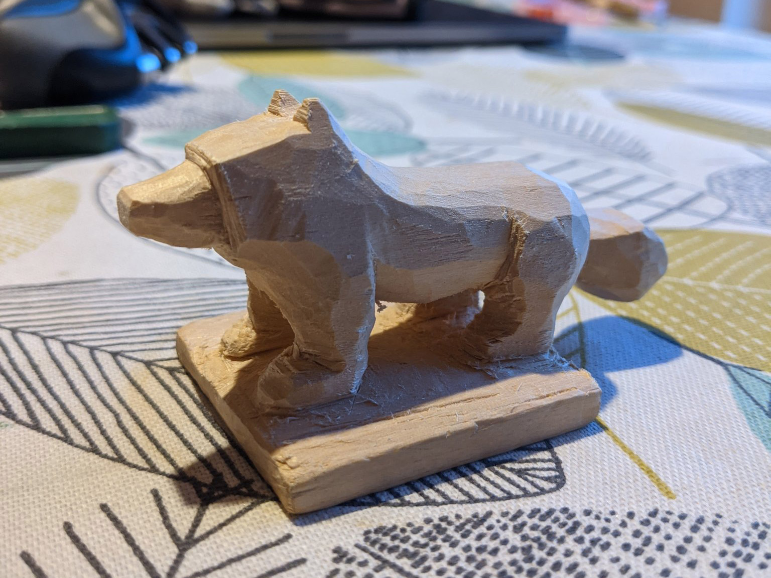 Side angle of the dog, mostly formed now, the snout, eats, legs, belly, back and tail are all clear, though proportions are a little off, it might be confused with a bear