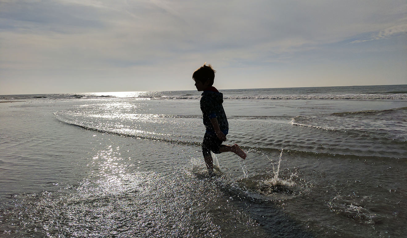 Ellis running on the beach